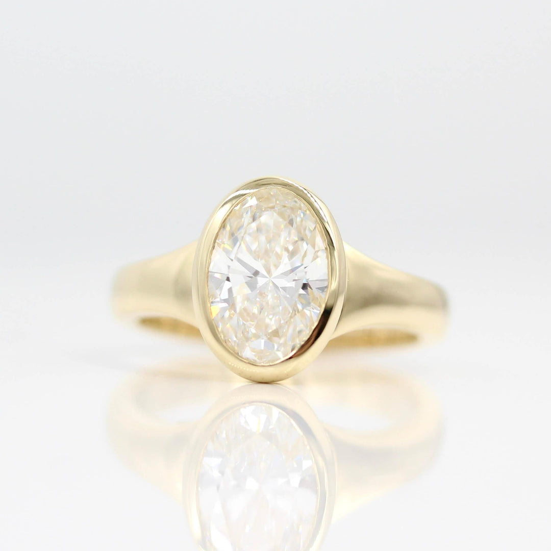 The Billie Ring (Oval) in Yellow Gold with 2ct Lab-Grown Diamond against a white background