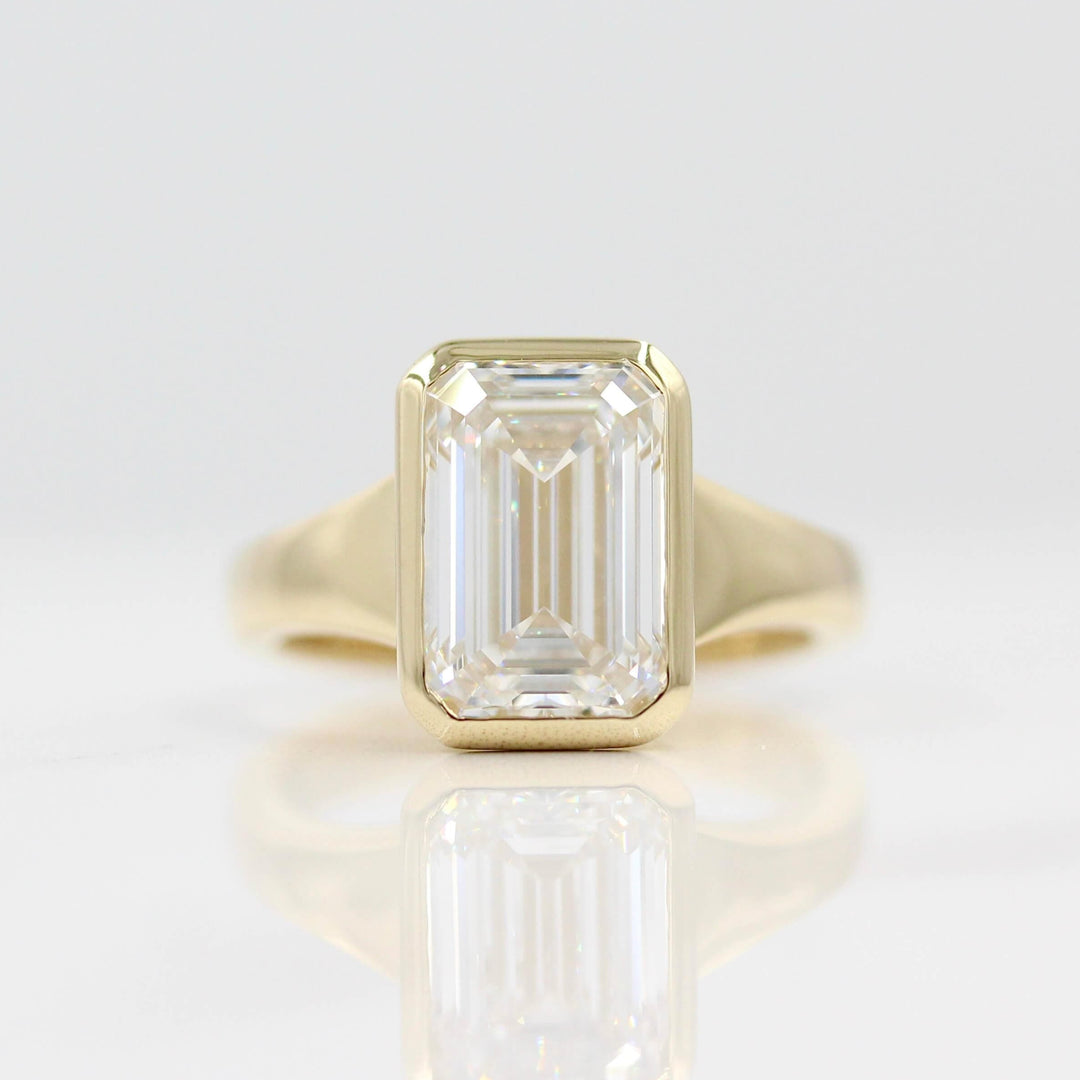 The Billie Ring in Yellow Gold with a 4ct Emerald Lab-Grown Diamond against a white background