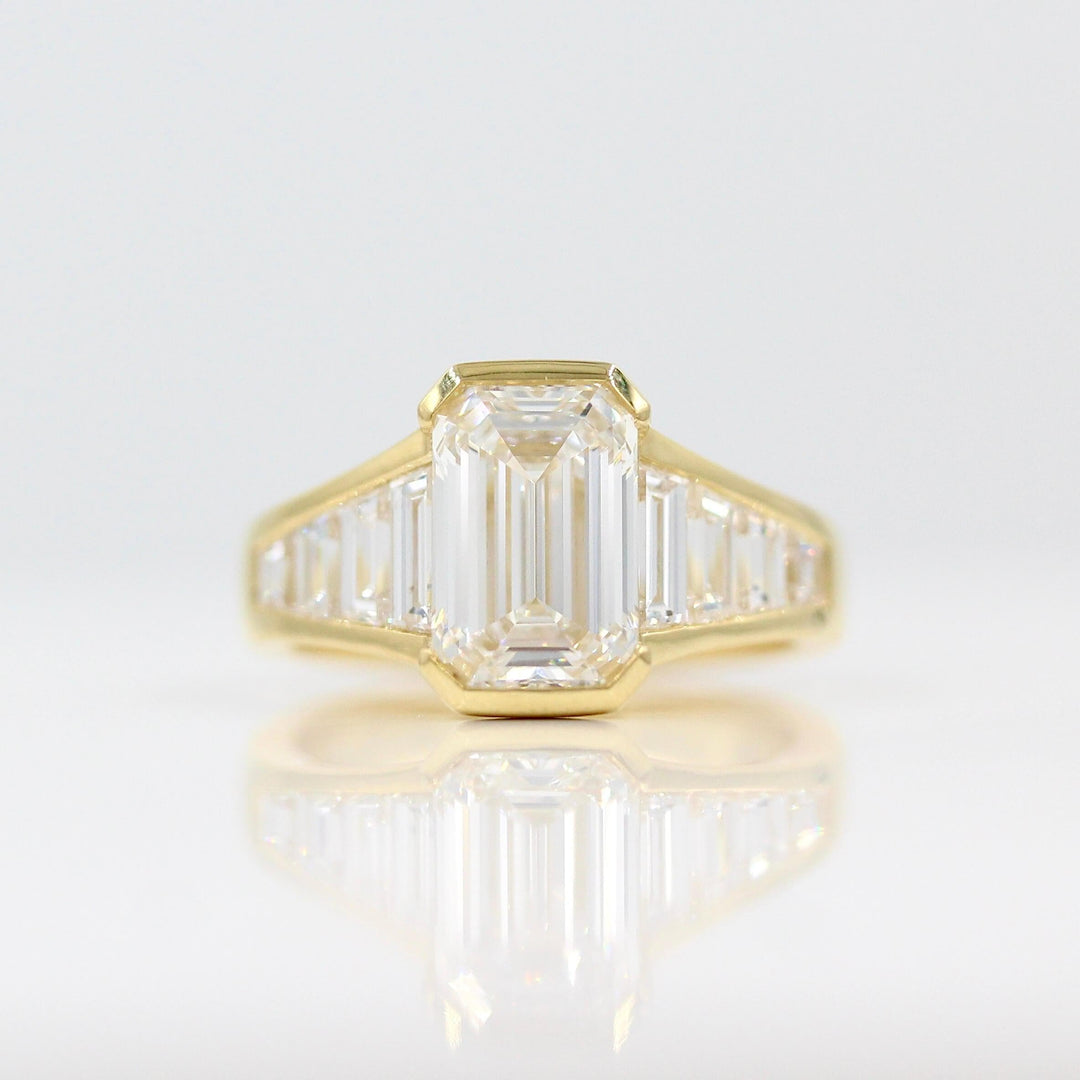 The Daphne Ring with a 3ct Emerald Lab-Grown Diamond in 18k Yellow Gold against a white background