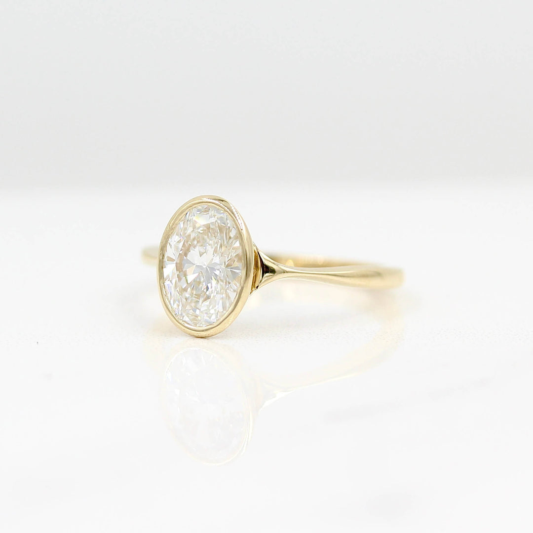 The Stevie Ring (Oval) in Yellow Gold with Lab Grown Diamond against a white background
