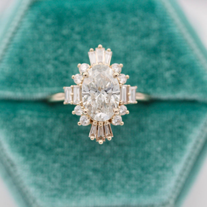 The Kortni Art Deco Engagement Ring in a teal velvet ring box