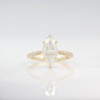 Engagement Ring The Maisie Ring in Yellow Gold with 2ct Marquise Moissanite against a white background