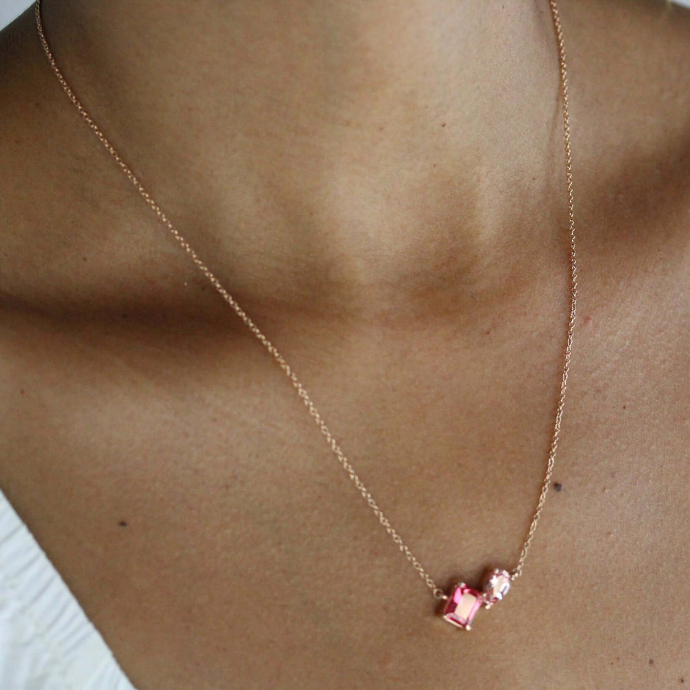 Rose gold necklace with radiant created padparadscha sapphire and pear peachy-pink created sapphire