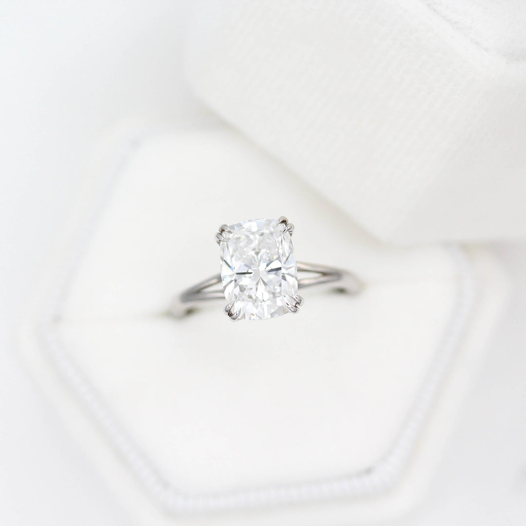 The Sage Ring in White Gold with a 3ct Elongated Cushion Lab-Grown Diamond in a white velvet ring box