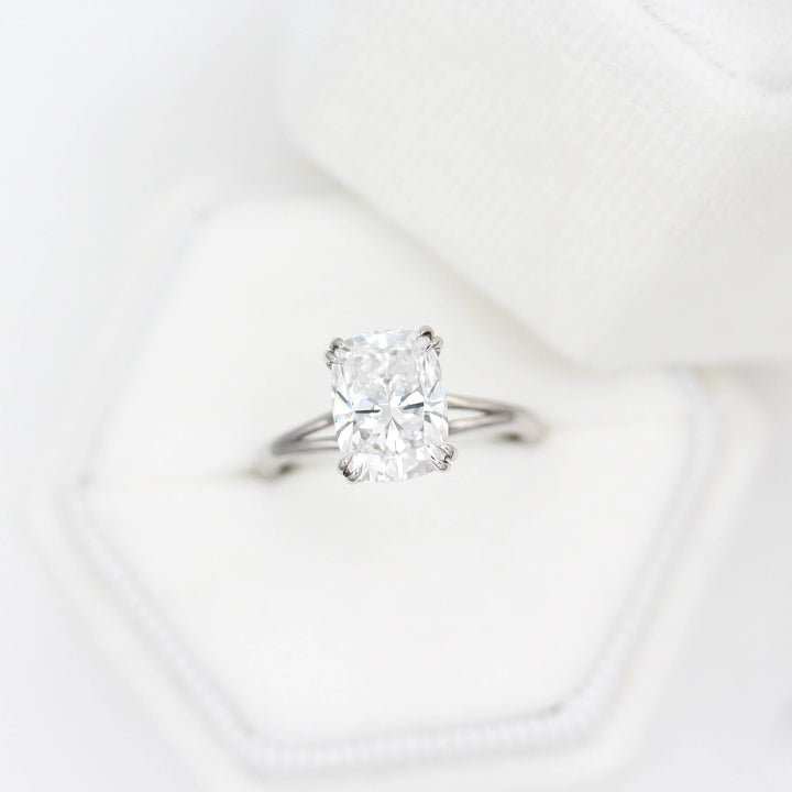 The Sage Ring in White Gold with a 3ct Elongated Cushion Lab-Grown Diamond in a white velvet ring box
