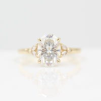 Ready to Ship Ring 14k Yellow Gold The Sophia Ring (Oval) in Yellow Gold with 2ct Moissanite against a white background