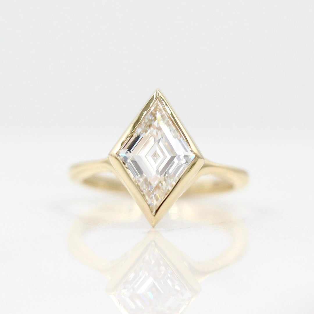 Engagement Ring The Stevie Ring in Yellow Gold with a 2ct Lozenge Lab-Grown Diamond against a white background