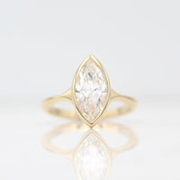 The Stevie Ring (Marquise) in Yellow Gold with a 2ct Lab-Grown Diamond against a white background