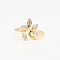 Yellow gold ring with five diamond marquise on a white background