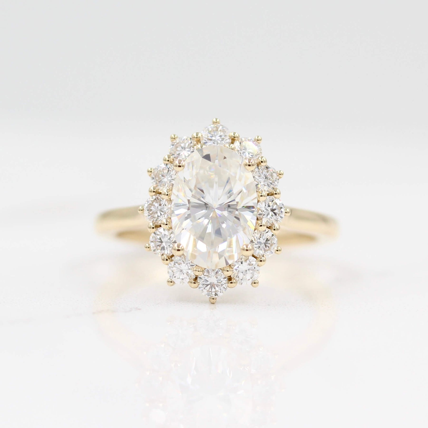 The Allie Ring (Oval) in Yellow Gold with 2ct Moissanite against a white background