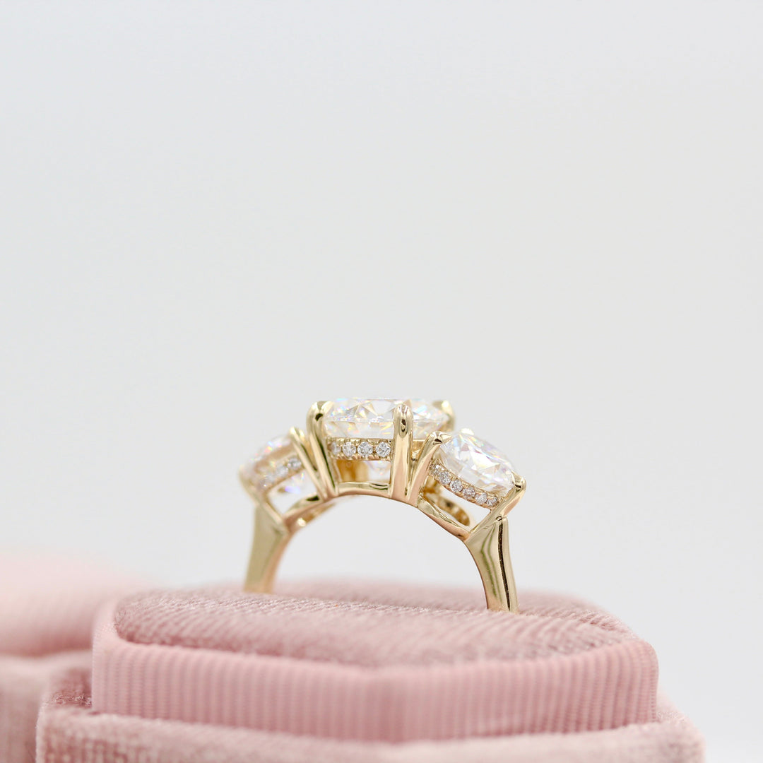 hidden halo three-stone ring