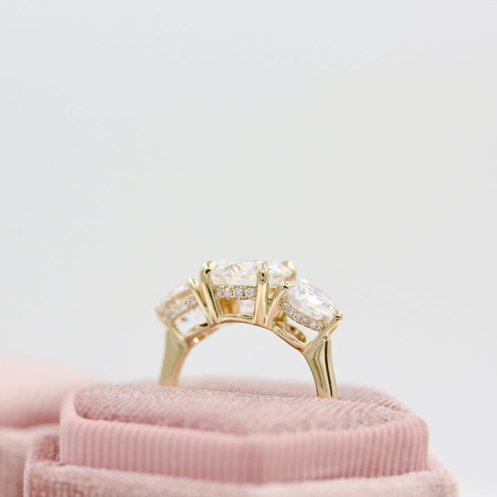 hidden halo three-stone ring