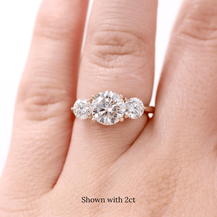 rose gold three-stone diamond ring