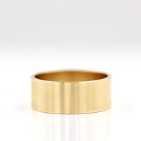 The 8mm Cigar Band in Yellow Gold against a white background