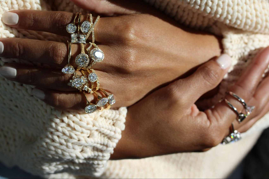 stacks of lab-grown diamond rings on hands