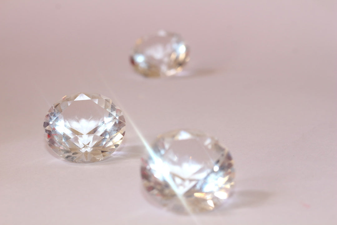 three diamond on a light pink background