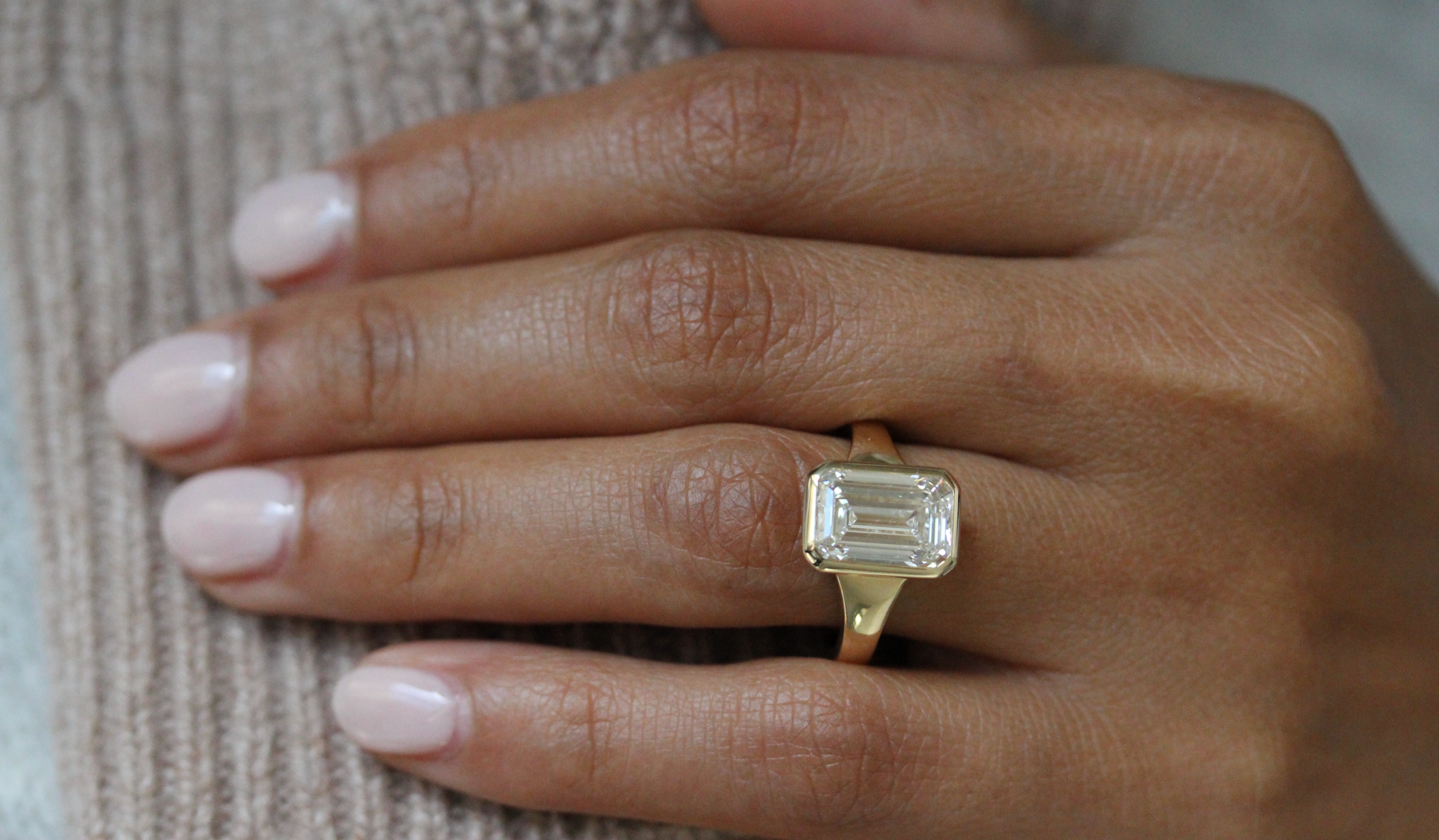 Customizable emerald-cut bezel engagement ring