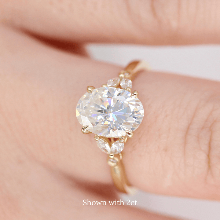 The Sophia Ring (Oval) in Yellow Gold and 2ct Moissanite modeled on a hand
