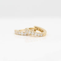 10mm Diamond Huggies in Yellow Gold against a white background