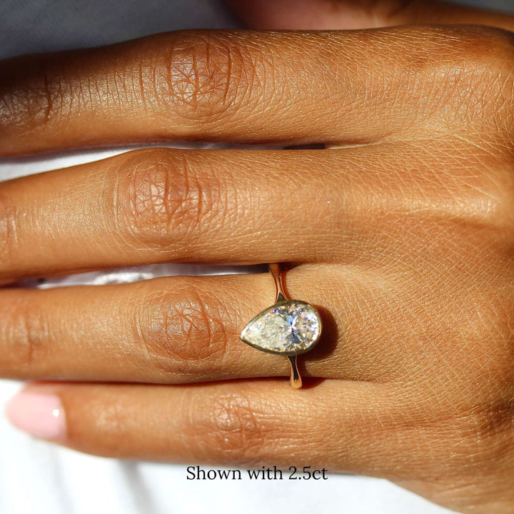 The Stevie Ring (Pear) in Yellow Gold with 2.5ct Moissanite modeled on a hand