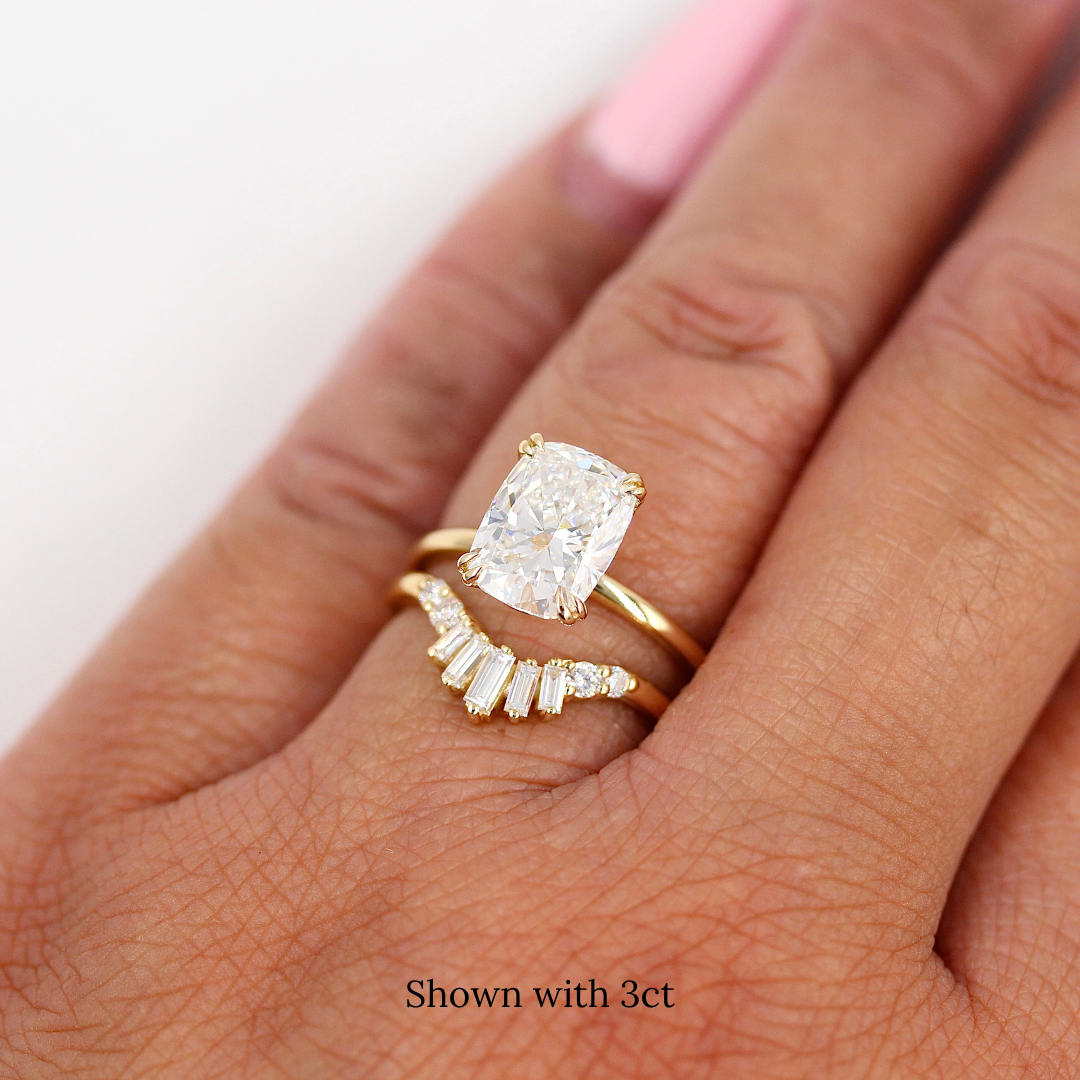 The Serena Ring (Elongated Cushion) with 3ct Lab-Grown Diamond in yellow gold stacked with the Sunburst wedding band in yellow gold modeled on a hand