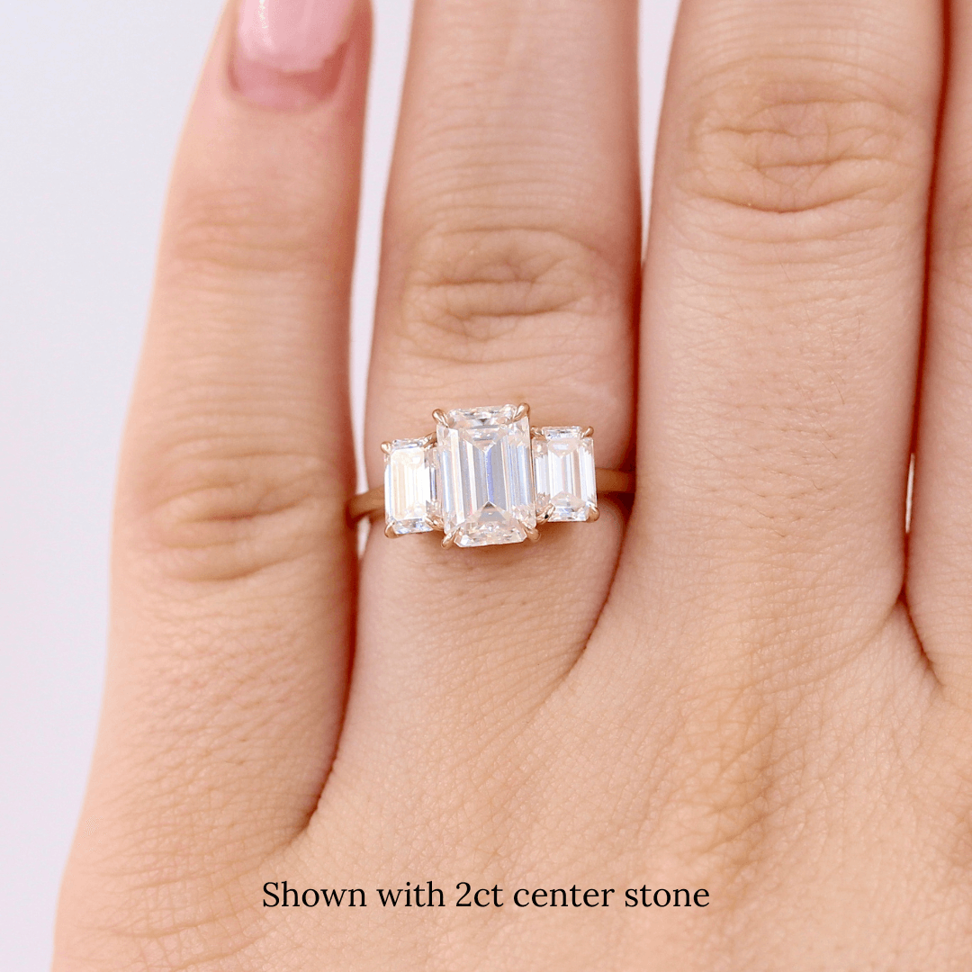 The Kendall Hidden Halo Ring in Yellow Gold with Moissanite modeled on a hand
