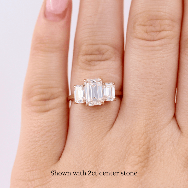 The Kendall Hidden Halo Ring in Yellow Gold with Moissanite modeled on a hand