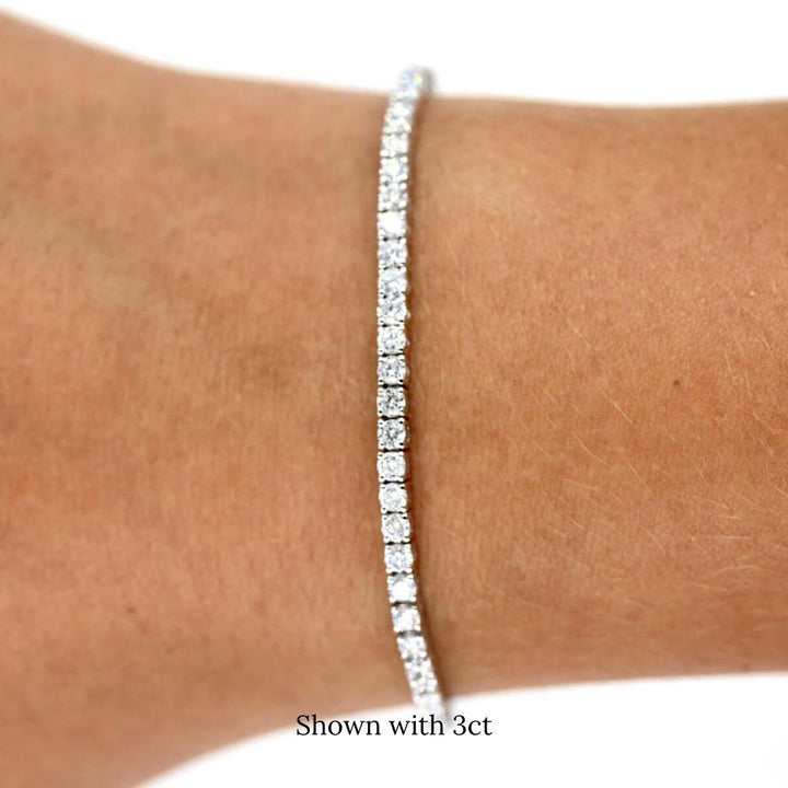 The Classic Lab Grown Diamond Tennis Bracelet in White Gold and 3ct modeled on a hand