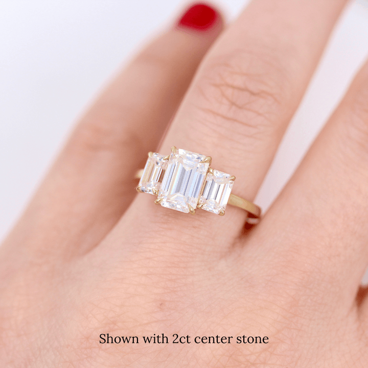 The Kendall Hidden Halo Ring in Yellow Gold with Moissanite modeled on a hand