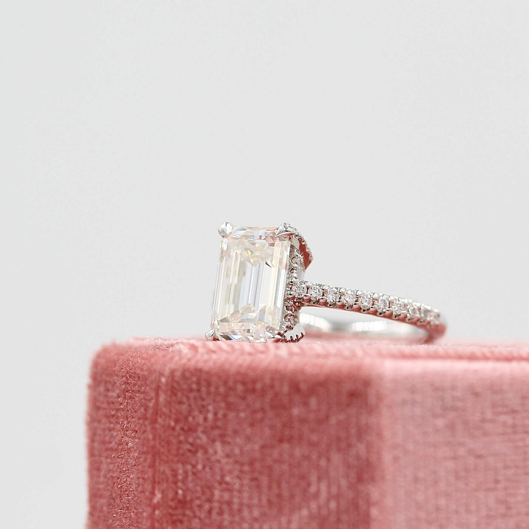 The Victoria Ring in White Gold and Moissanite on a pink velvet ring box