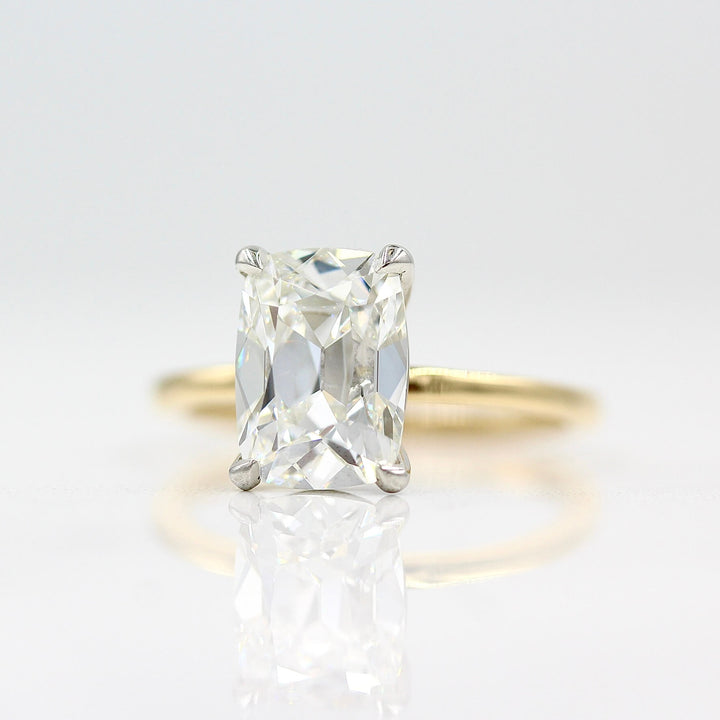 The Eri Ring in Platinum and 18k Yellow Gold with a 3ct Lab Grown Diamond against a white background