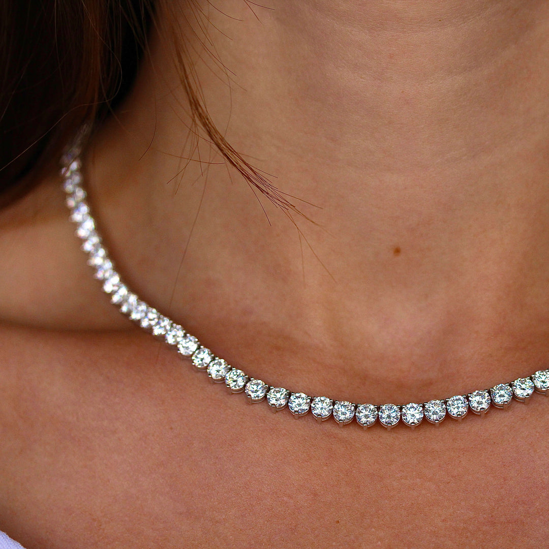 The Lab Grown Diamond Tennis Necklace in white gold modeled on a neck