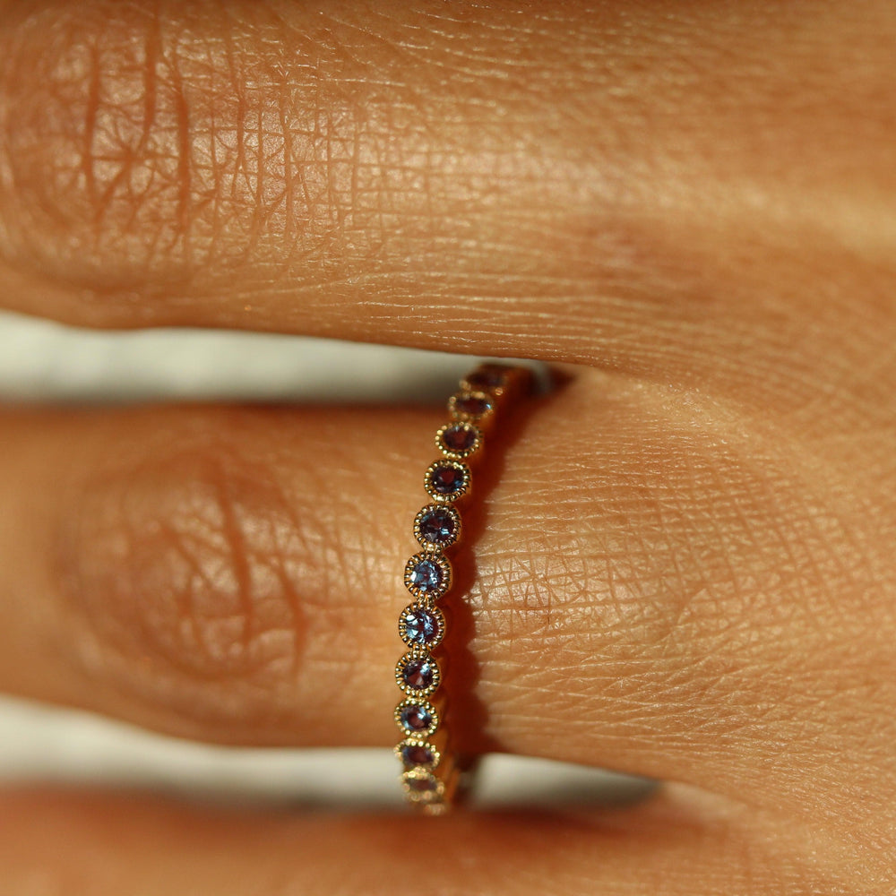 The June Florence Birthstone Wedding Band with Alexandrite modeled