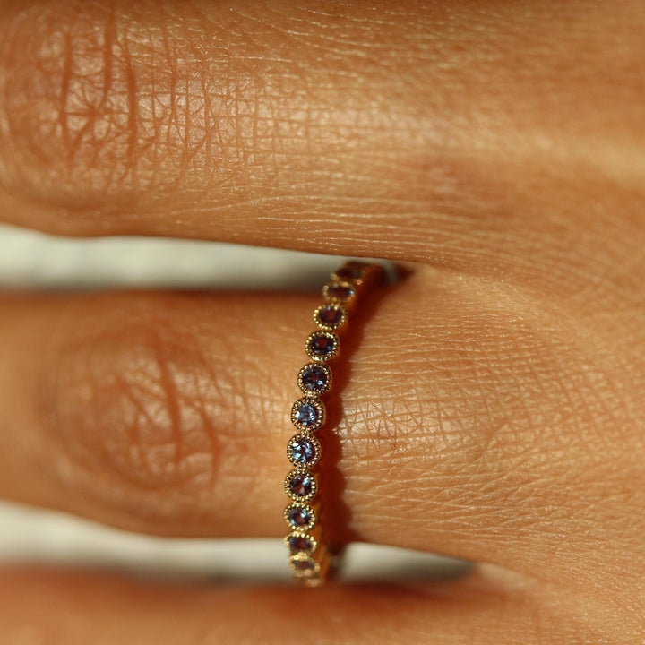 The June Florence Birthstone Wedding Band with Alexandrite modeled