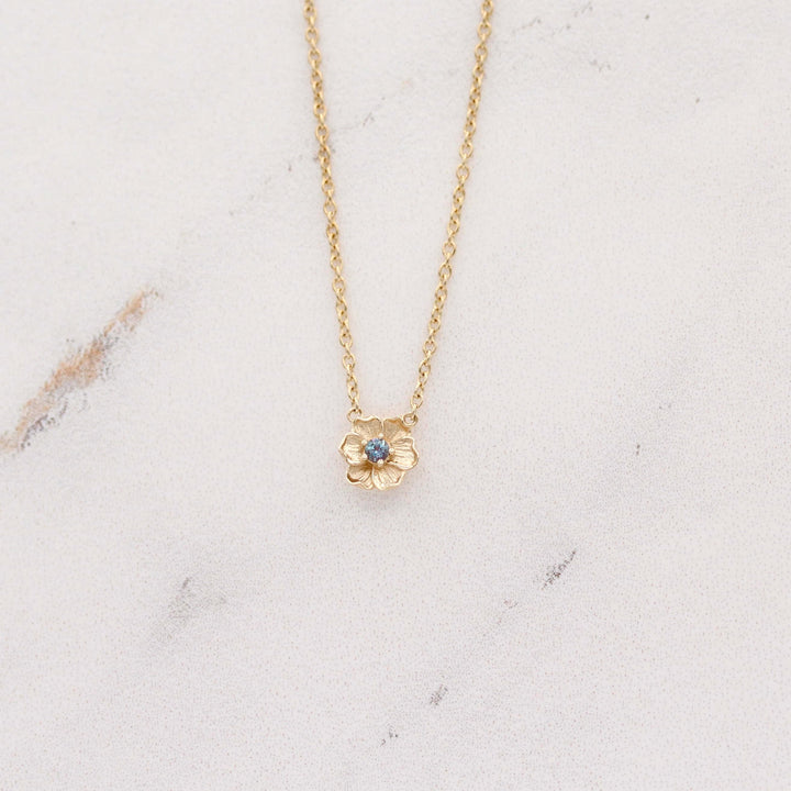 The June Birthstone Poppy Necklace with Alexandrite in Yellow Gold against a white background