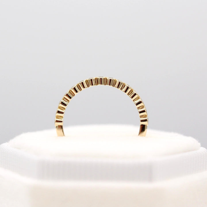 The March Florence Birthstone Wedding Band with Aqua Spinel in Yellow Gold in a white velvet ring box