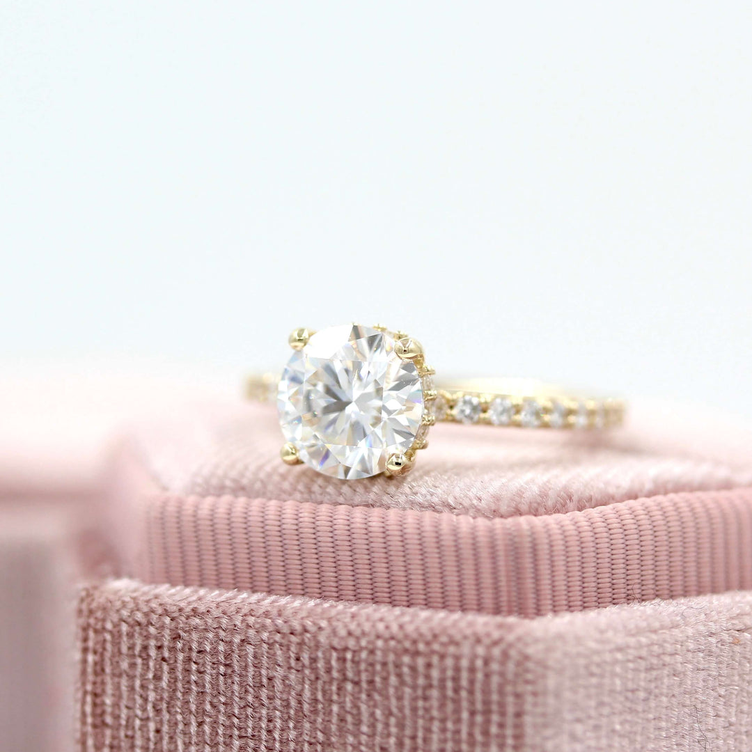 yellow gold ring round center moissanite with side accents