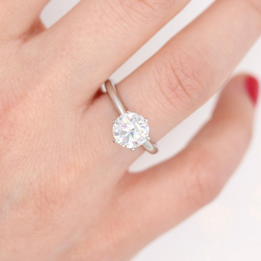 The Audrey Ring in White Gold and 2ct Moissanite modeled on a hand