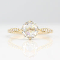 The Aurora Ring (Round) in Yellow Gold with 1.5ct Moissanite against a white background
