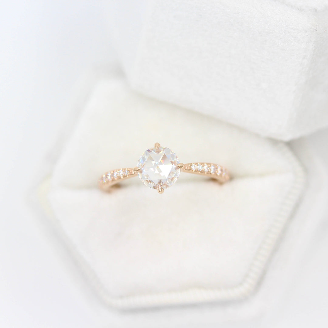 The Aurora Ring (Round) in Rose Gold and 1ct Moissanite in a white velvet ring box