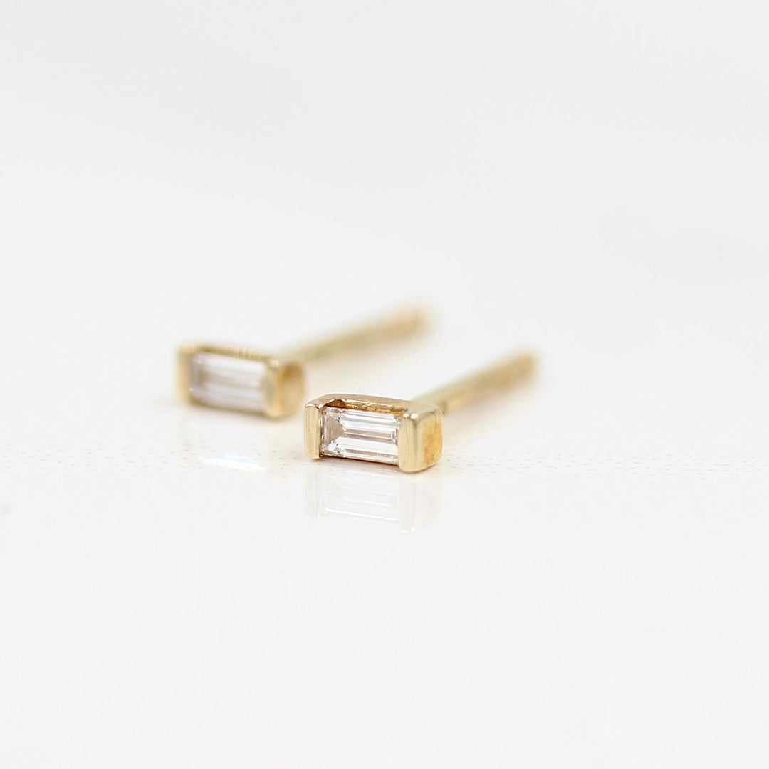 Baguette Earrings in Yellow Gold against a white background
