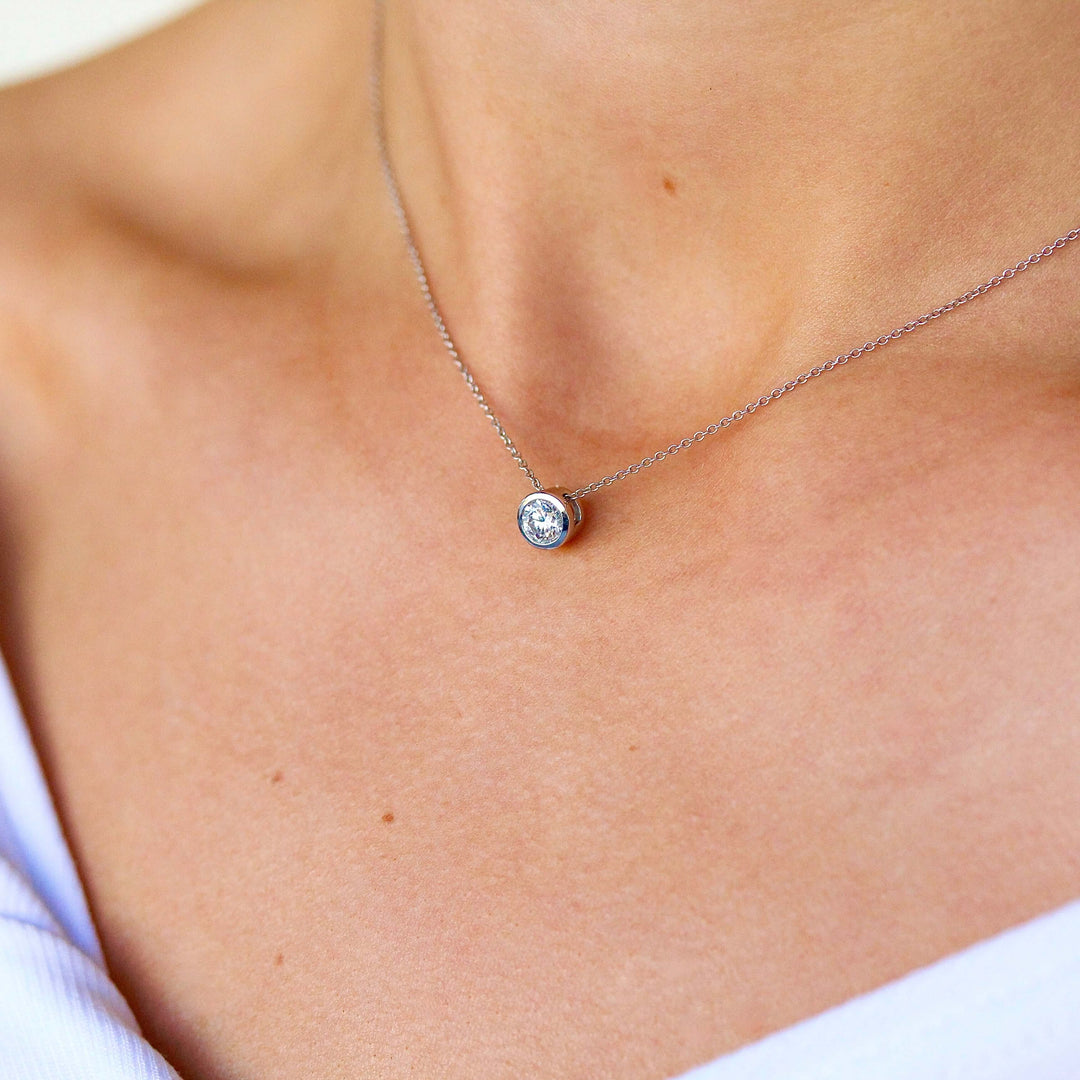 The 1/2ct Diamond Bezel Necklace in white gold modeled on a neck