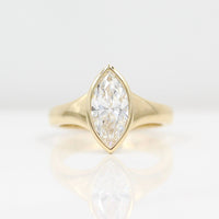 The Billie Ring (Marquise) in yellow gold against a white background