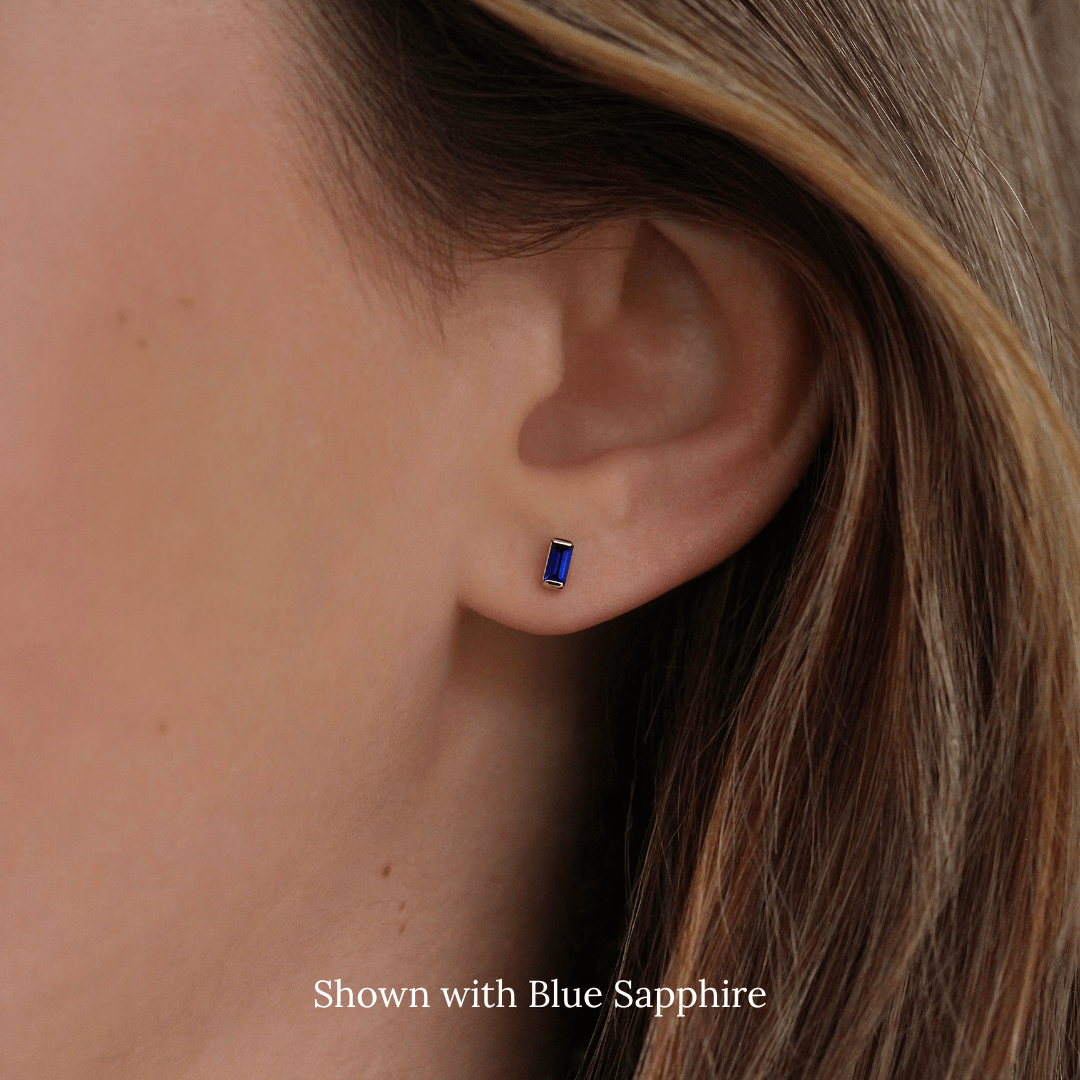 The September Baguette Birthstone Earrings with Blue Sapphire in Yellow Gold modeled