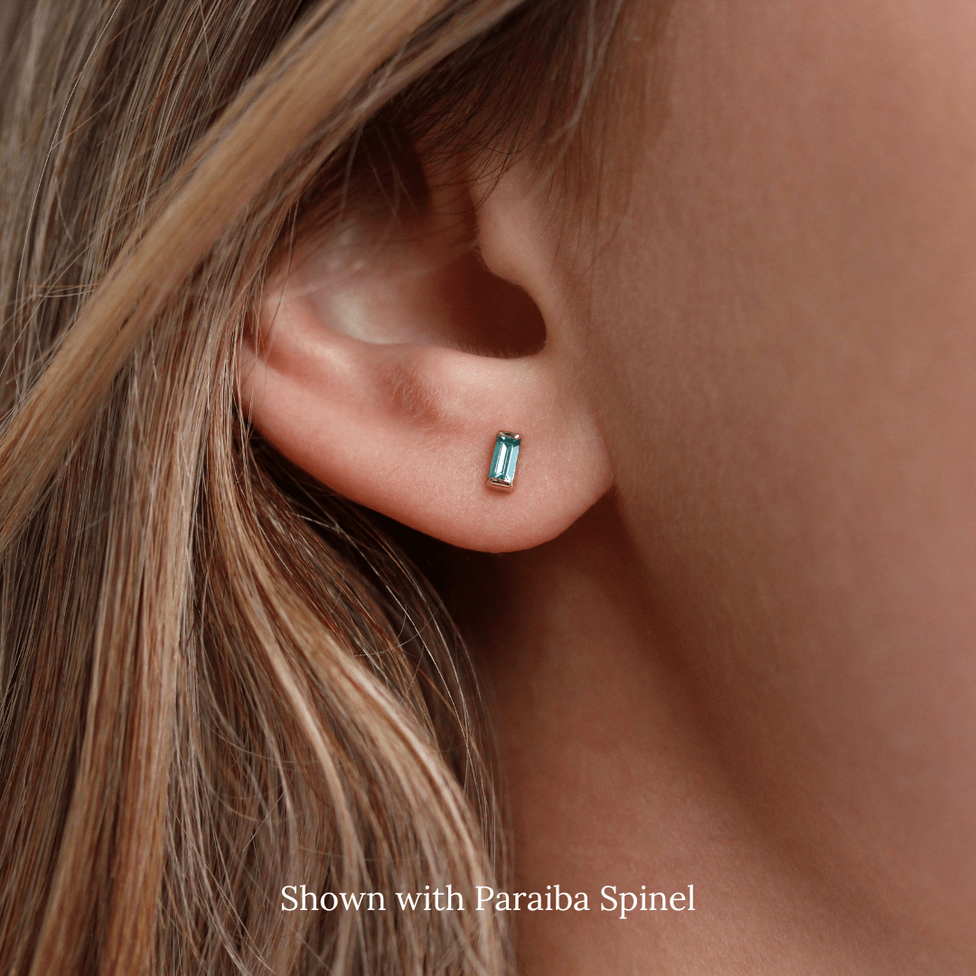 The December Baguette Birthstone Earrings with Paraiba Spinel in Yellow Gold modeled
