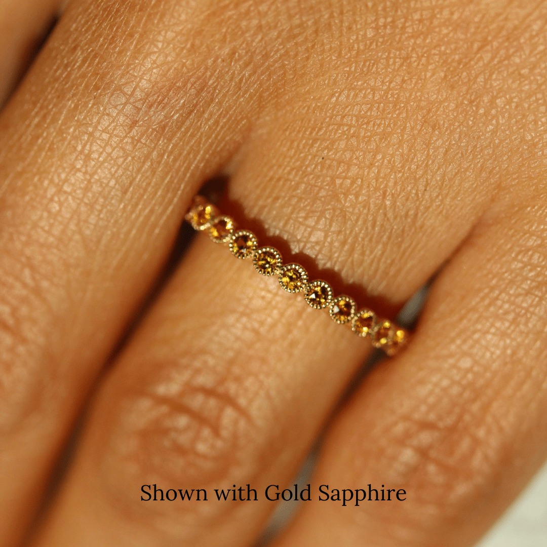 The November Florence Birthstone Band with Gold Sapphire in Yellow Gold modeled on a hand