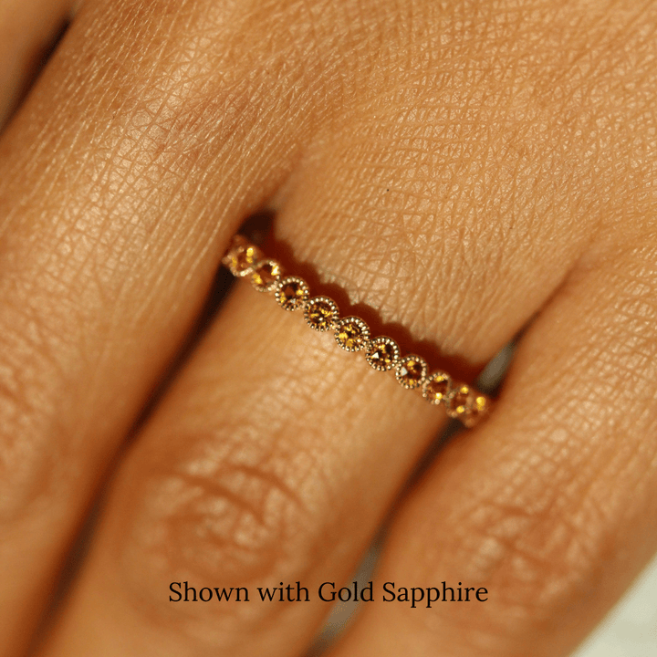 The November Florence Birthstone Band with Gold Sapphire in Yellow Gold modeled on a hand
