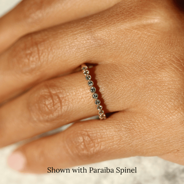 The December Florence Birthstone Band with Paraiba Spinel in Yellow Gold modeled