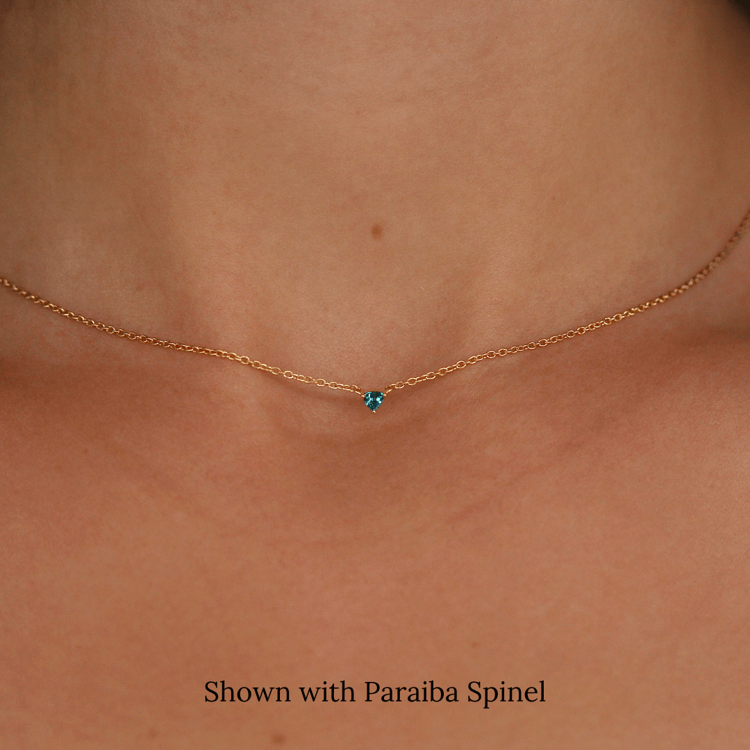 The December Tiny Trillion Birthstone Necklace with Paraiba Spinel in Yellow Gold modeled