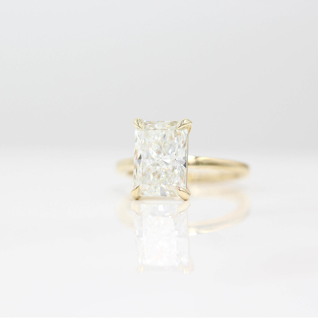  The Celeste Ring (Radiant) in Yellow Gold with 3.75ct Lab-Grown Diamond against a white background